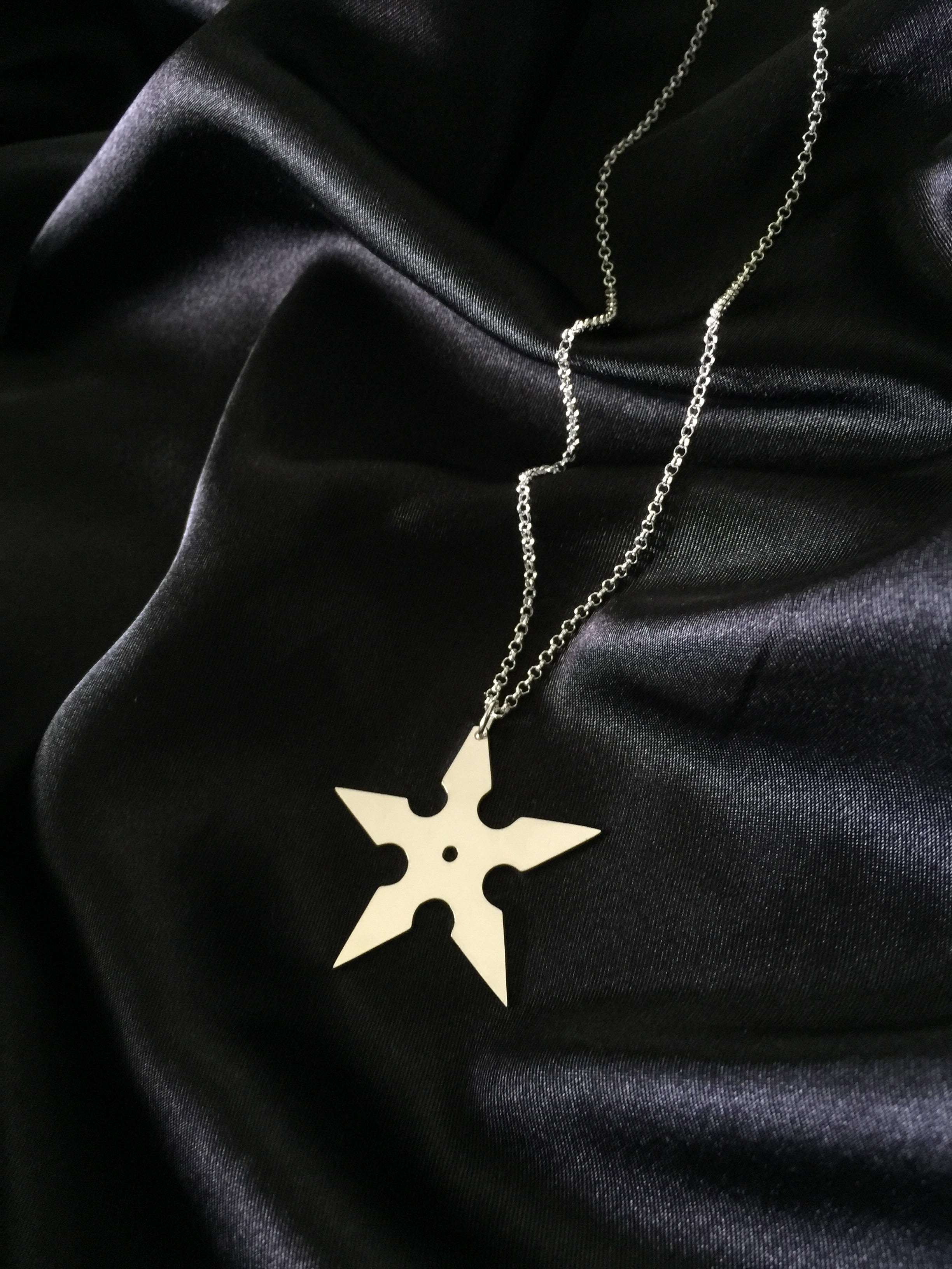 Throwing Star Necklace.